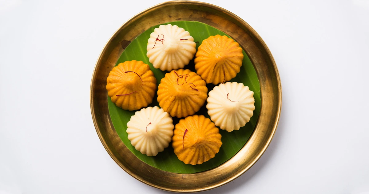 Modak for Ganesha during Ganesh Chaturthi in train